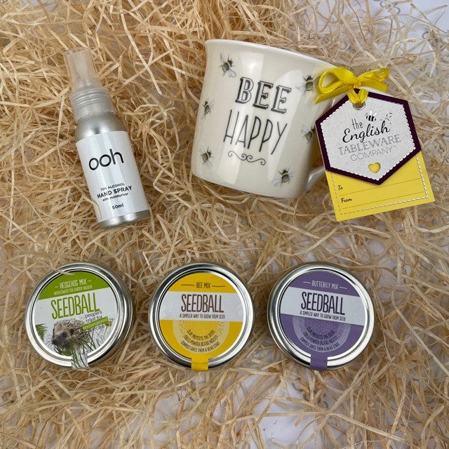 A garden lovers dream gift box.  With 3 tins of ready to sow seed balls perfect for attracting wildlife to your garden, beautifully combined with a Bee Happy english tableware mug and hand sanitiser.